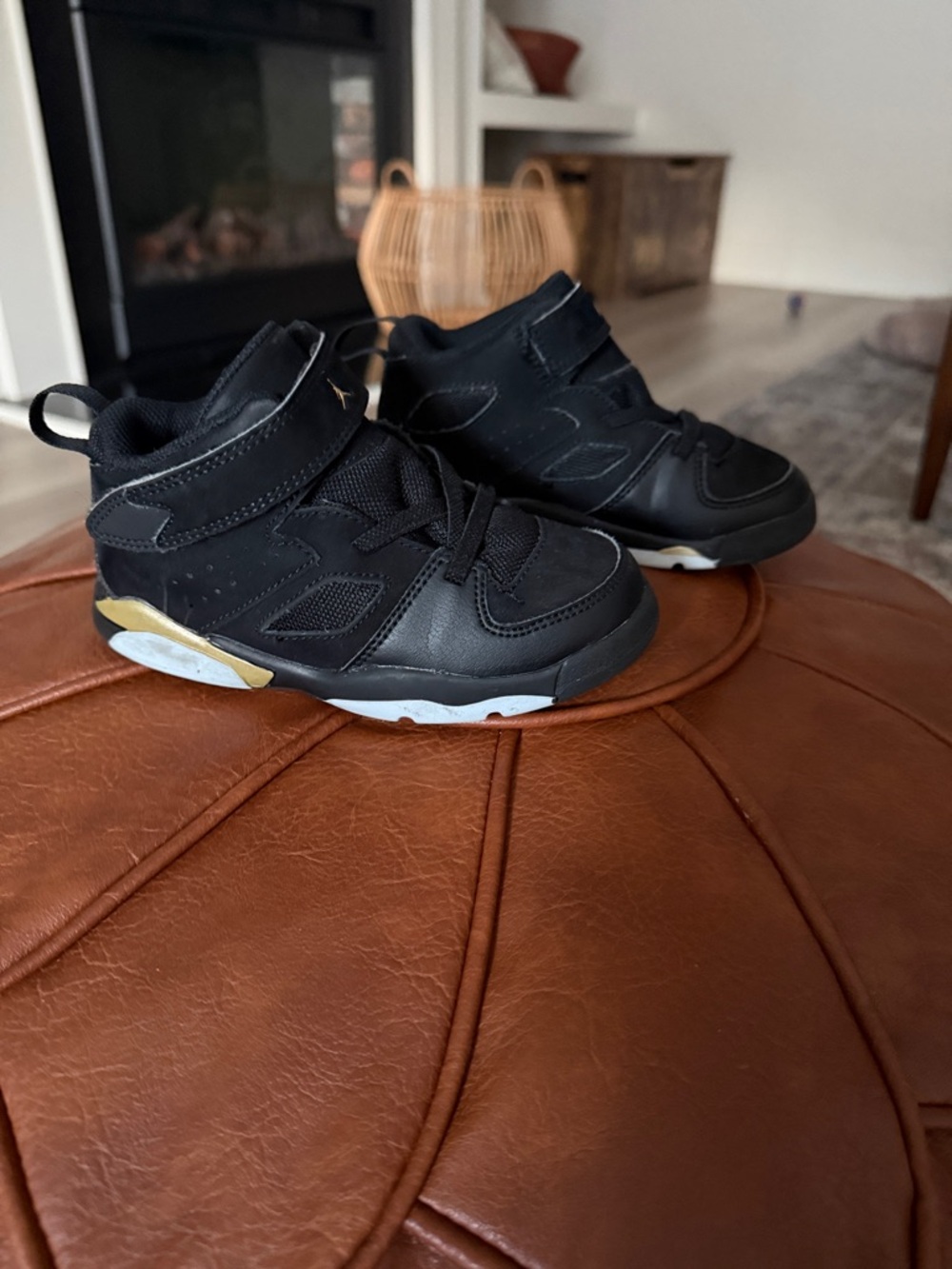 Kids Jordan Black and Gold High-Top Sneakers